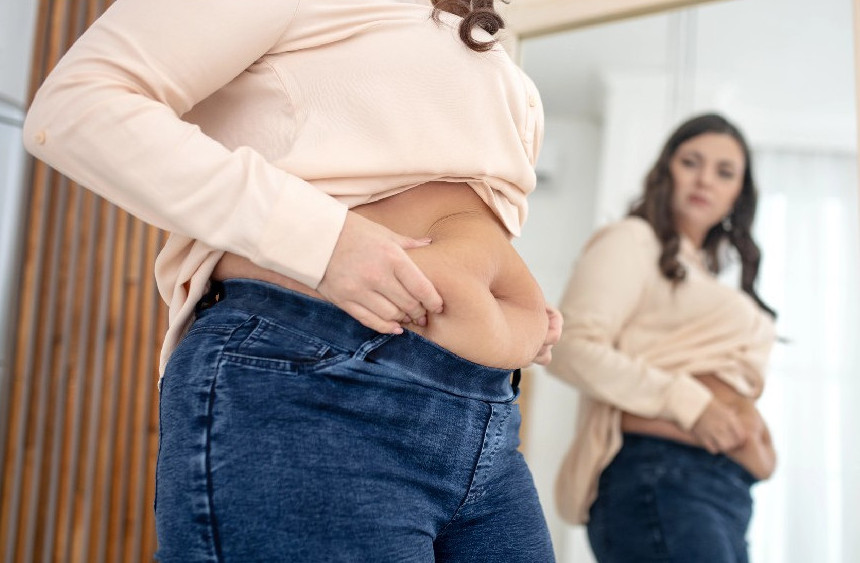 Patient celebrating weight loss transformation at Oneka Bariatrics
